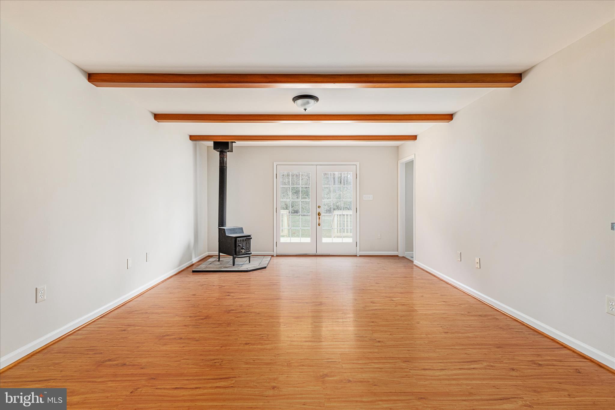 2983 Old Winchester Road Boyce, VA 22620 - Photo 50 of 91 a view of an empty room with wooden floor and a window