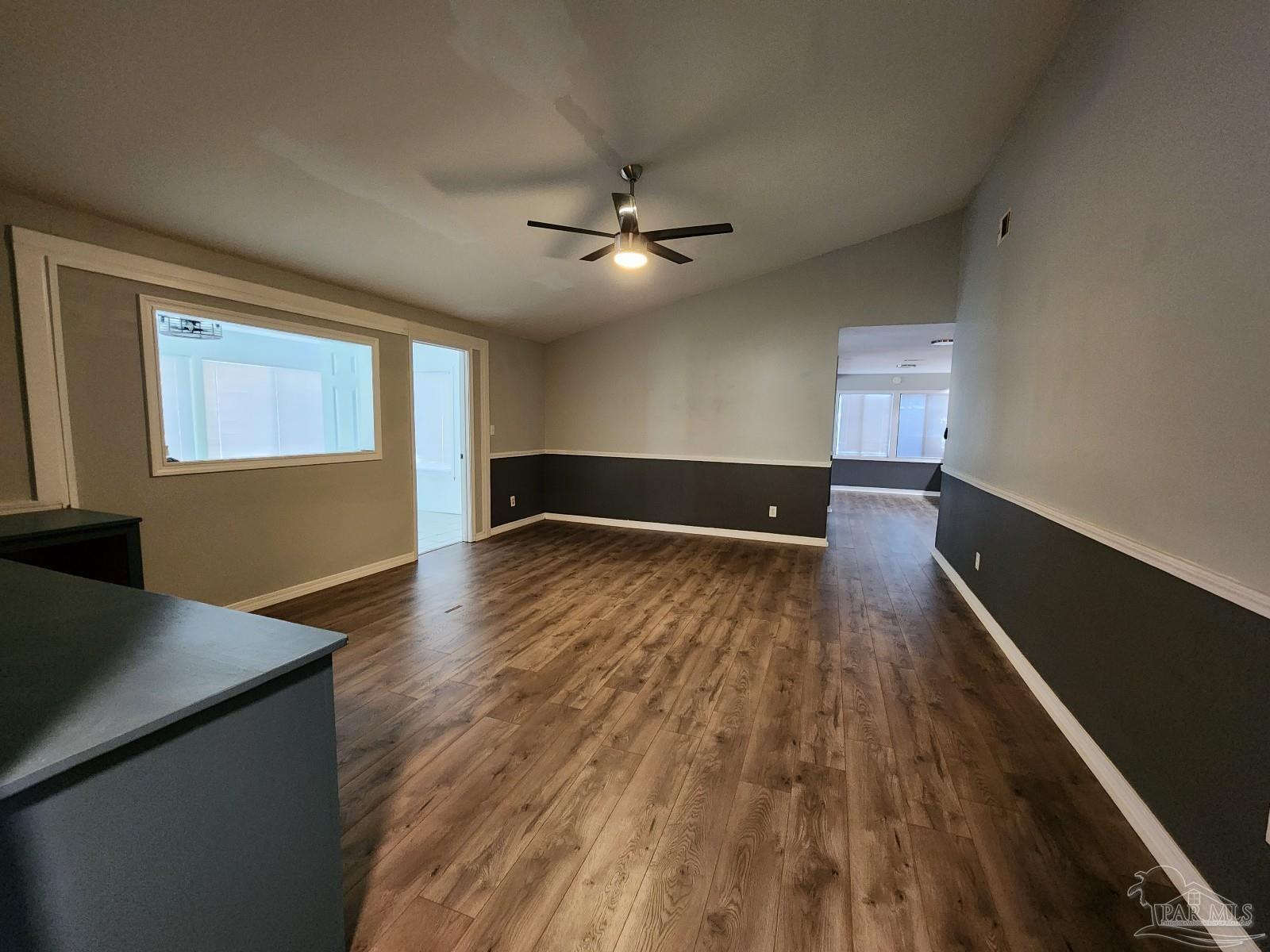 5140 Choctaw Avenue Pensacola, FL 32507 - Photo 13 of 25 wooden floor in an empty room with a window