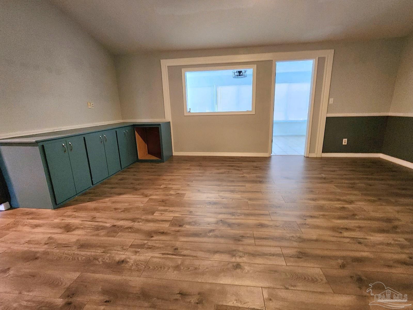 5140 Choctaw Avenue Pensacola, FL 32507 - Photo 8 of 25 a view of a room with wooden floor