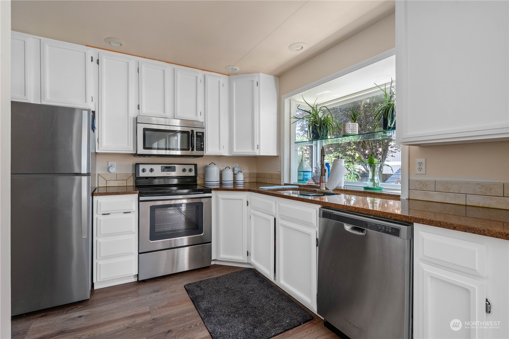 13631 Southeast 274th Place Kent, WA 98042 - Photo 12 of 31 a kitchen with a refrigerator stove and microwave