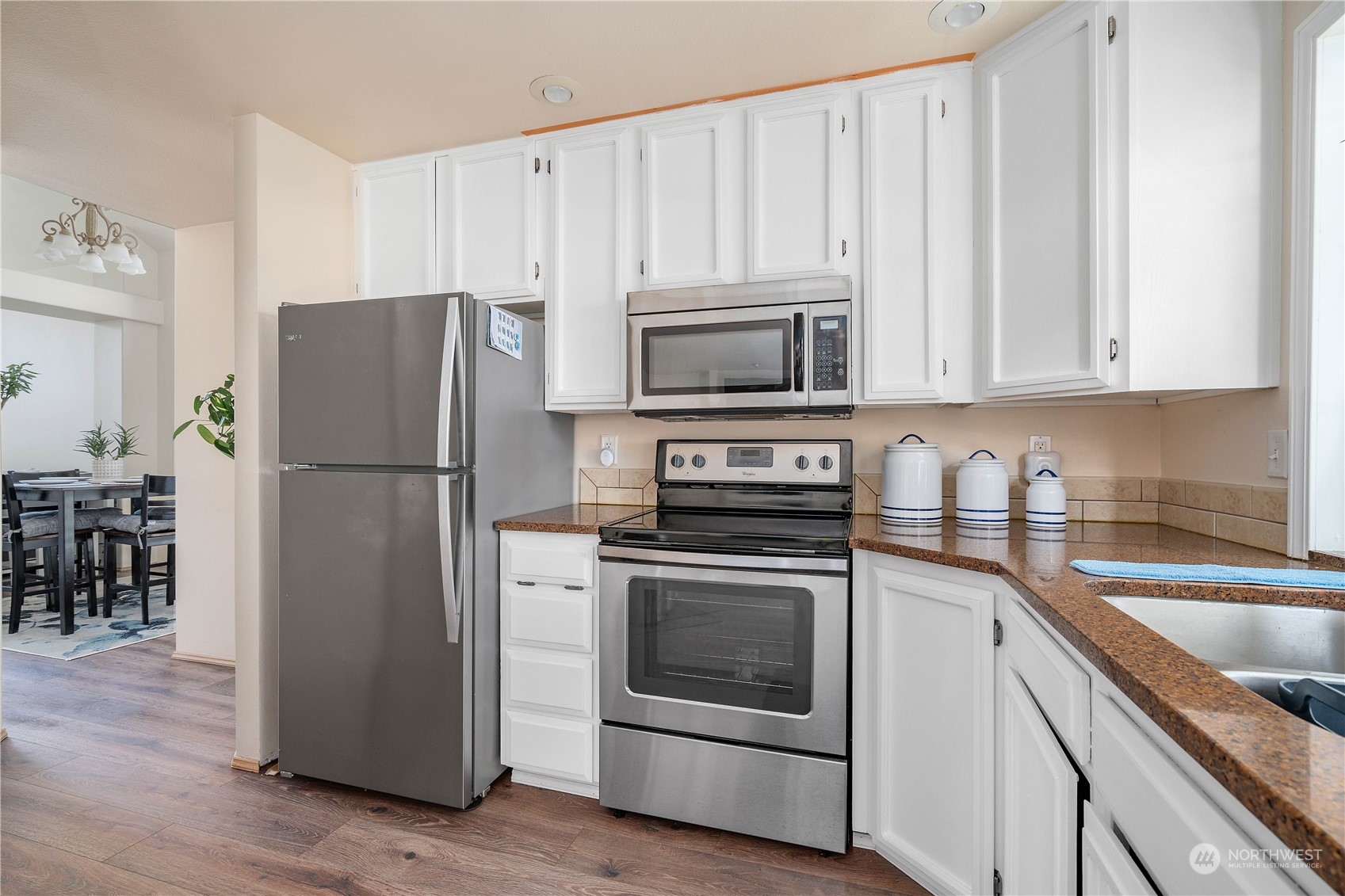 13631 Southeast 274th Place Kent, WA 98042 - Photo 13 of 31 a kitchen with a refrigerator stove and microwave