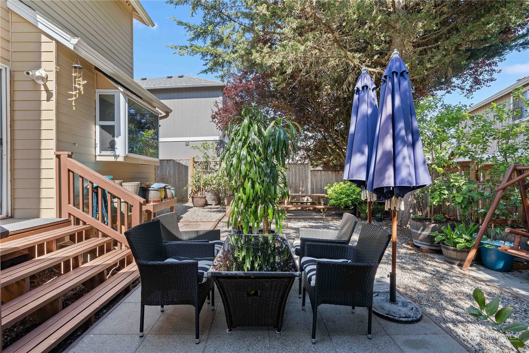 13631 Southeast 274th Place Kent, WA 98042 - Photo 22 of 31 a view of a patio with a table and chairs