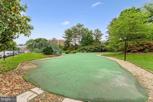 a view of a swimming pool and outdoor seating