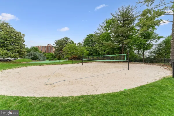a view of a patio with a table and chairs
