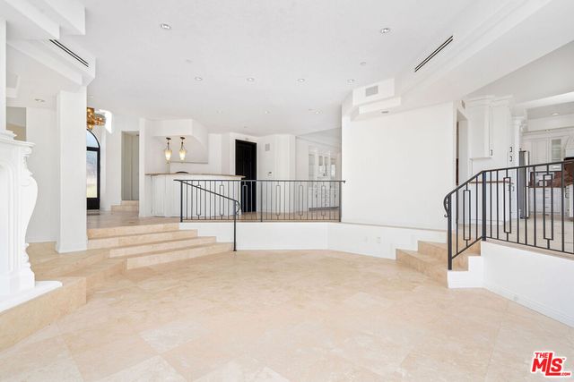 a view of empty room with a fireplace