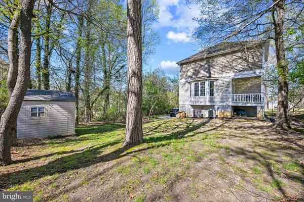 a view of house with yard