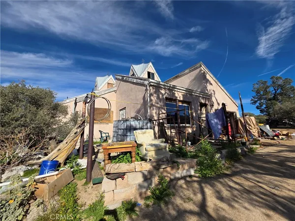 a view of a house with city street