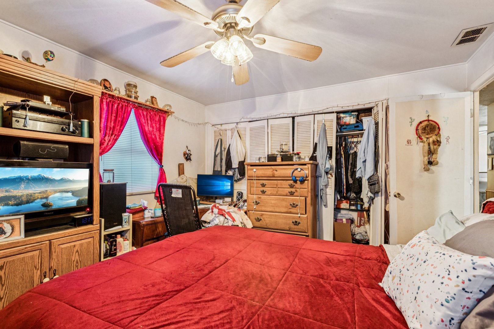 820 South Pine Street Streamwood, IL 60107 - Photo 12 of 23 a bed room with a bed and a flat tv screen