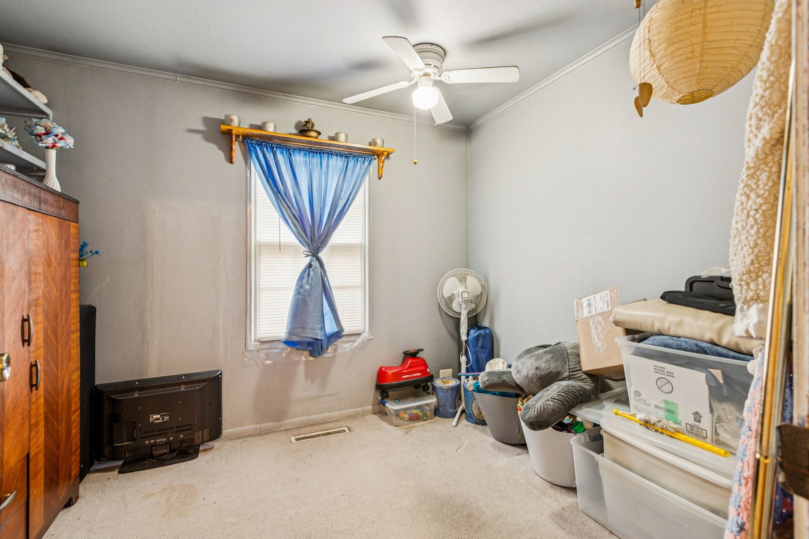 820 South Pine Street Streamwood, IL 60107 - Photo 16 of 23 a bedroom with a bed and a chandelier