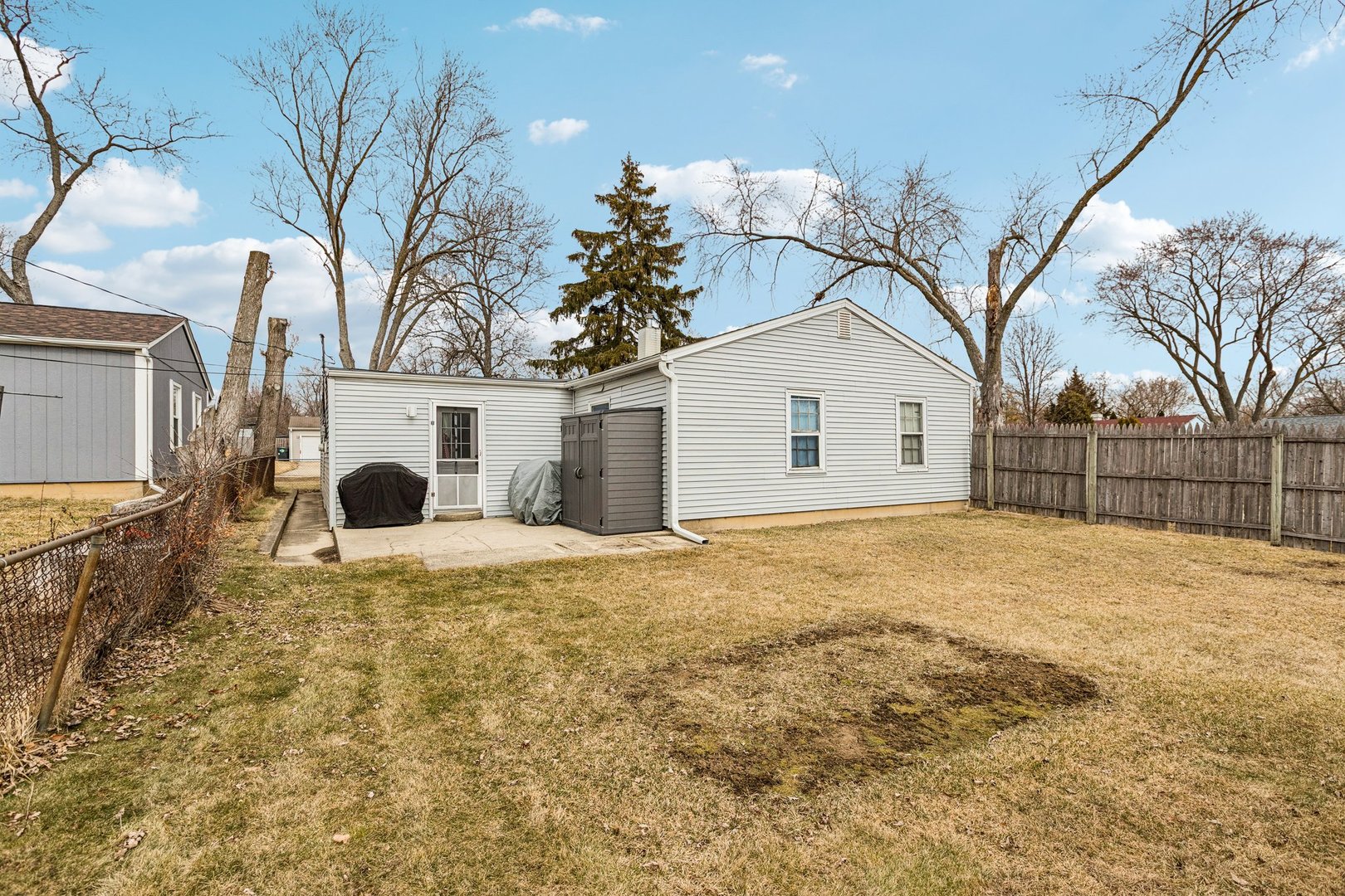 820 South Pine Street Streamwood, IL 60107 - Photo 22 of 23 a big white house with a large tree in front of it