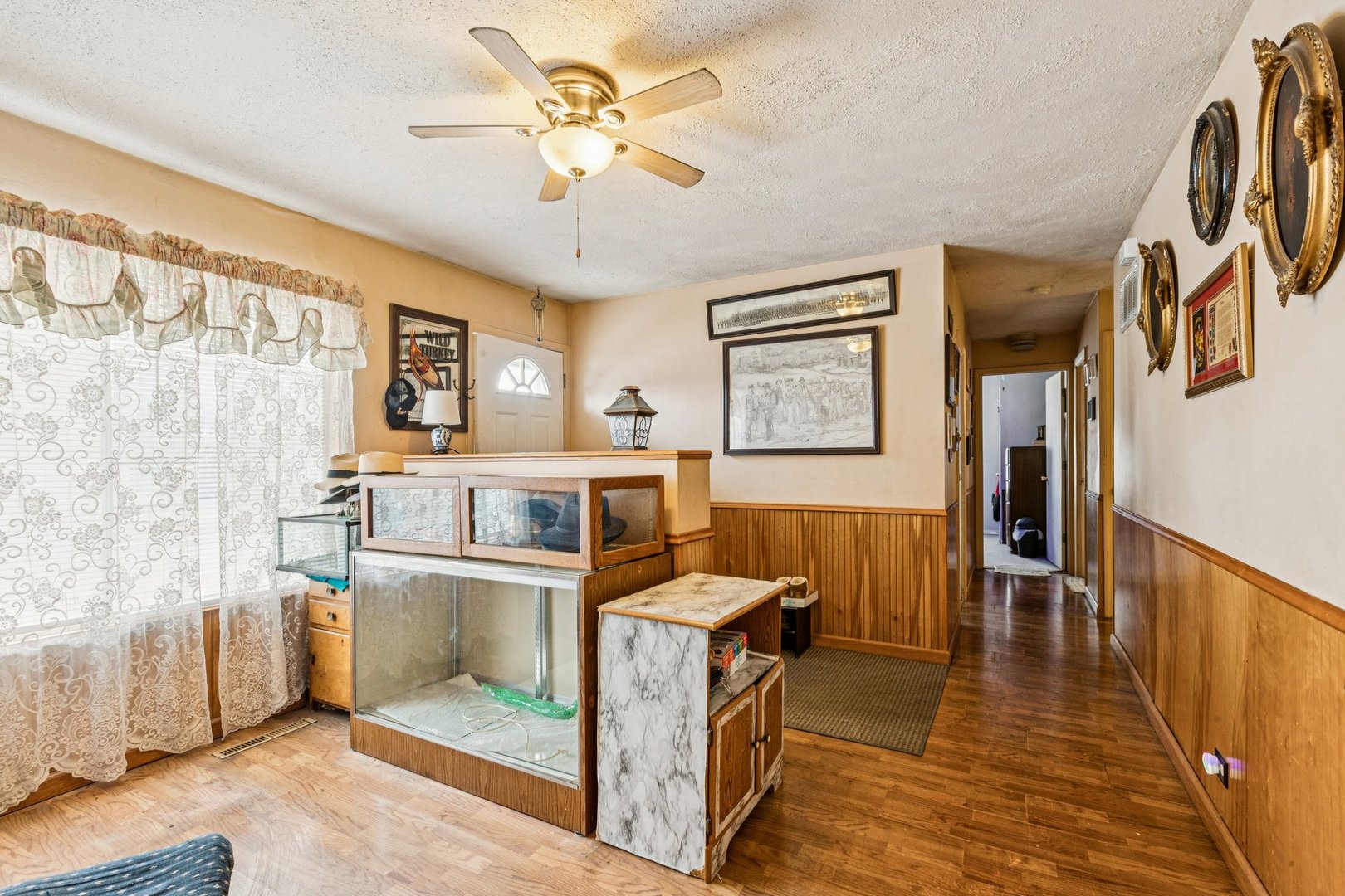 820 South Pine Street Streamwood, IL 60107 - Photo 5 of 23 a view of a livingroom with furniture wooden floor and a ceiling fan