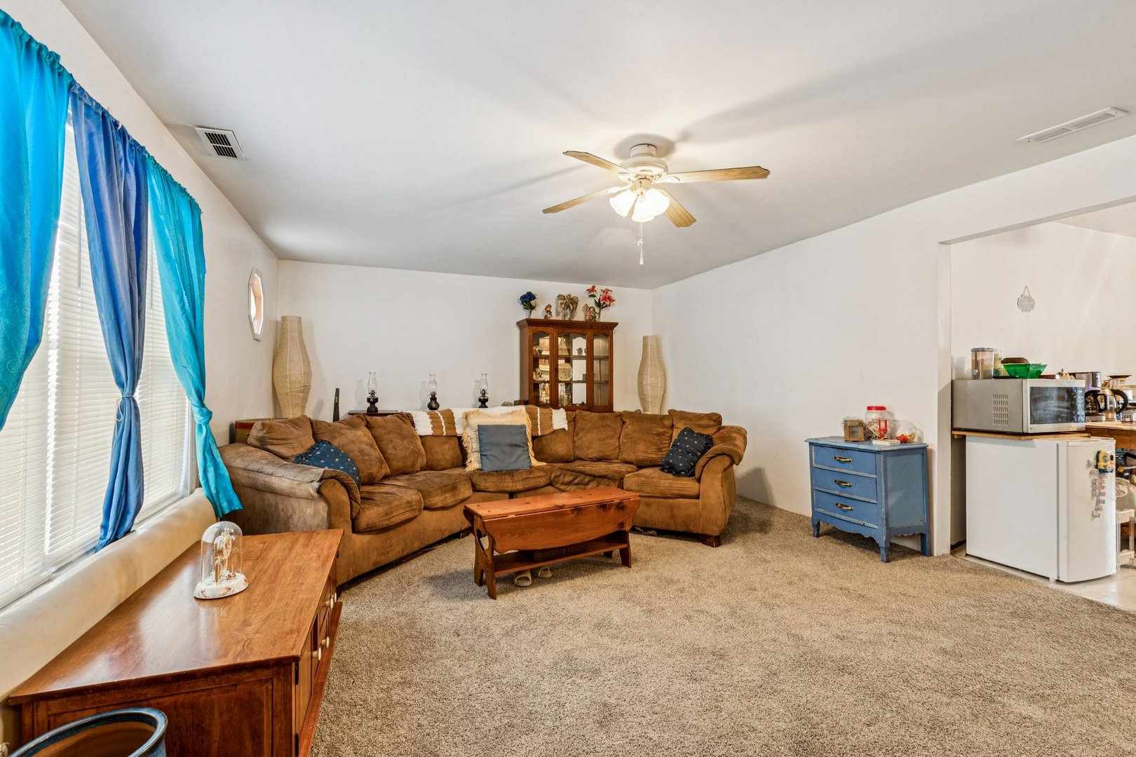 820 South Pine Street Streamwood, IL 60107 - Photo 6 of 23 a living room with furniture and a chandelier