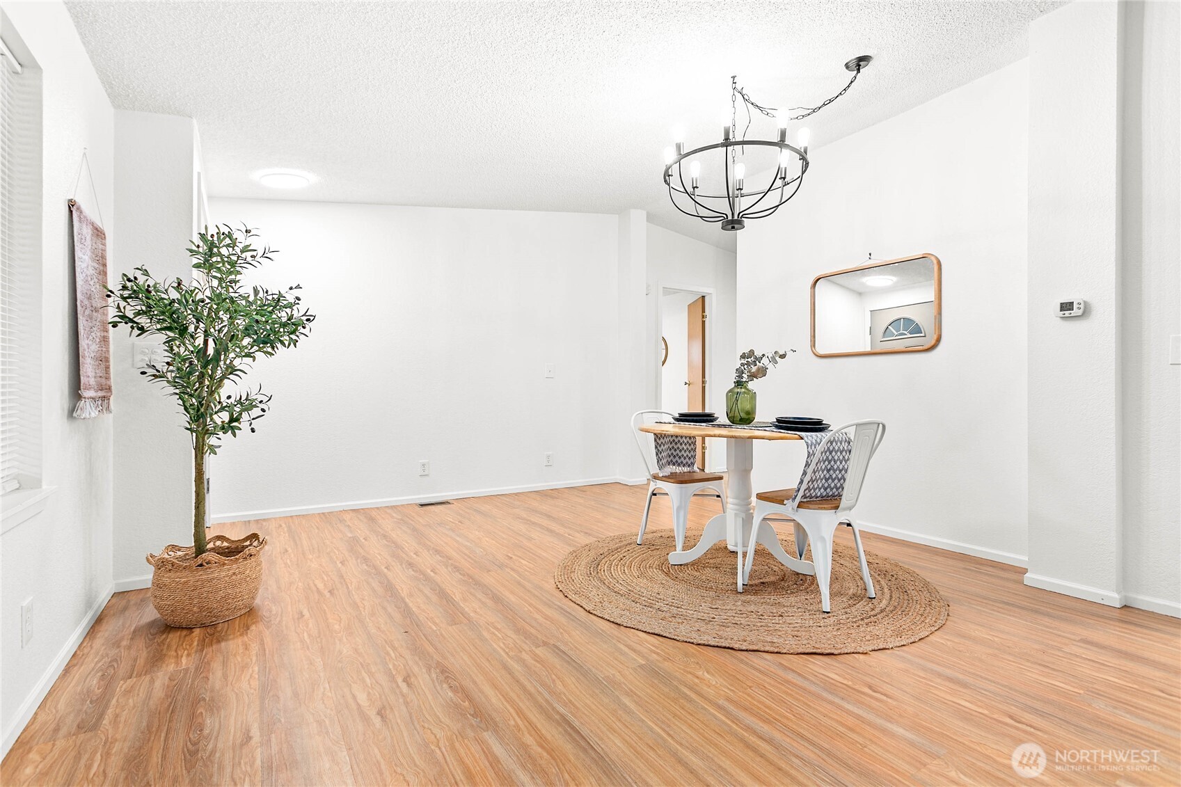 7343 Hannegan Road, Unit 2 Lynden, WA 98264 - Photo 13 of 34 a view of a dining room with furniture and wooden floor
