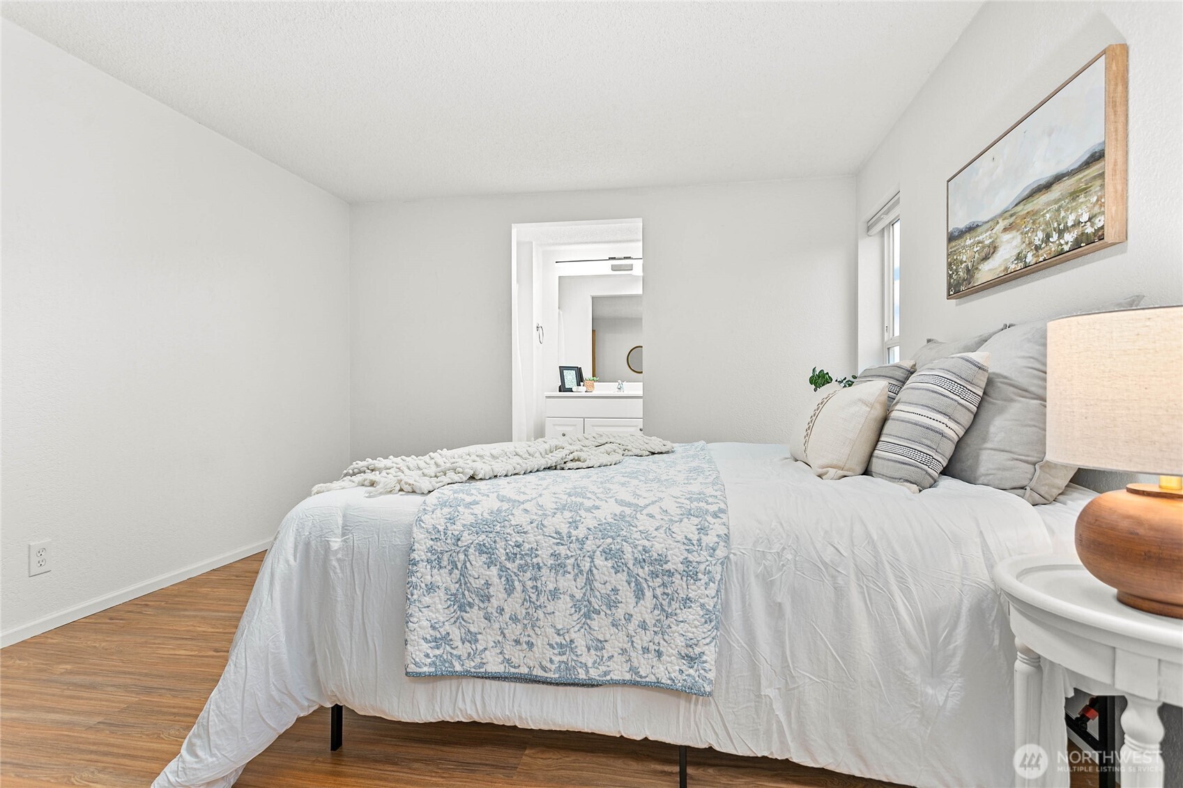 7343 Hannegan Road, Unit 2 Lynden, WA 98264 - Photo 16 of 34 a bedroom with a bed and wooden floor