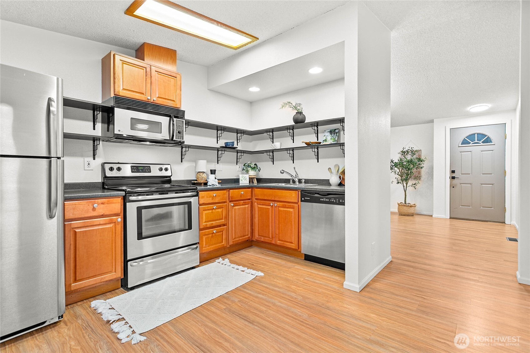7343 Hannegan Road, Unit 2 Lynden, WA 98264 - Photo 20 of 34 a kitchen with stainless steel appliances granite countertop a refrigerator sink and stove