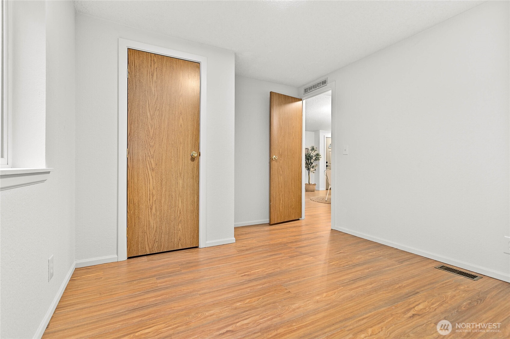 7343 Hannegan Road, Unit 2 Lynden, WA 98264 - Photo 25 of 34 a view of an empty room with wooden floor and closet