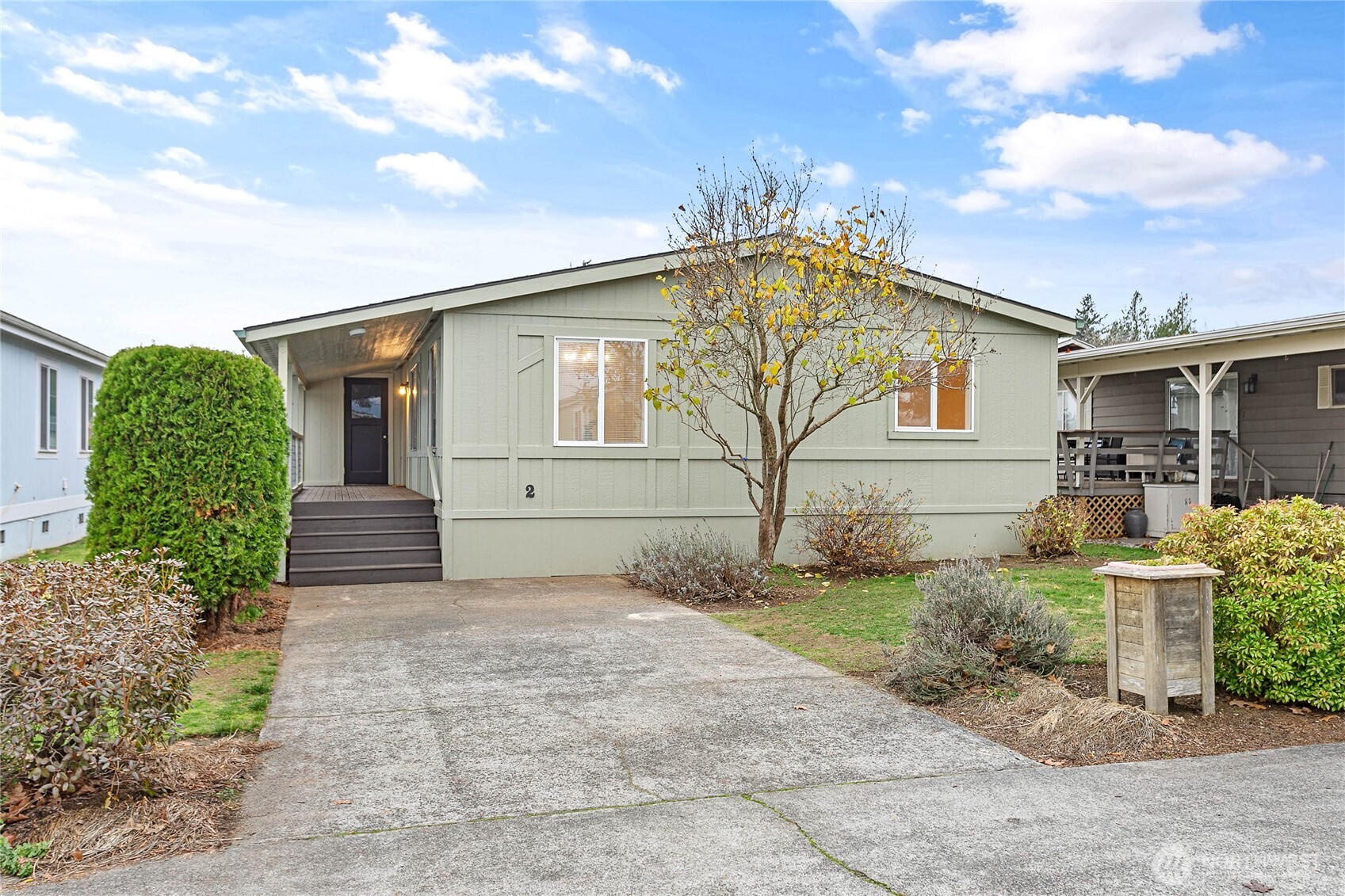 7343 Hannegan Road, Unit 2 Lynden, WA 98264 - Photo 31 of 34 a front view of a house with garden
