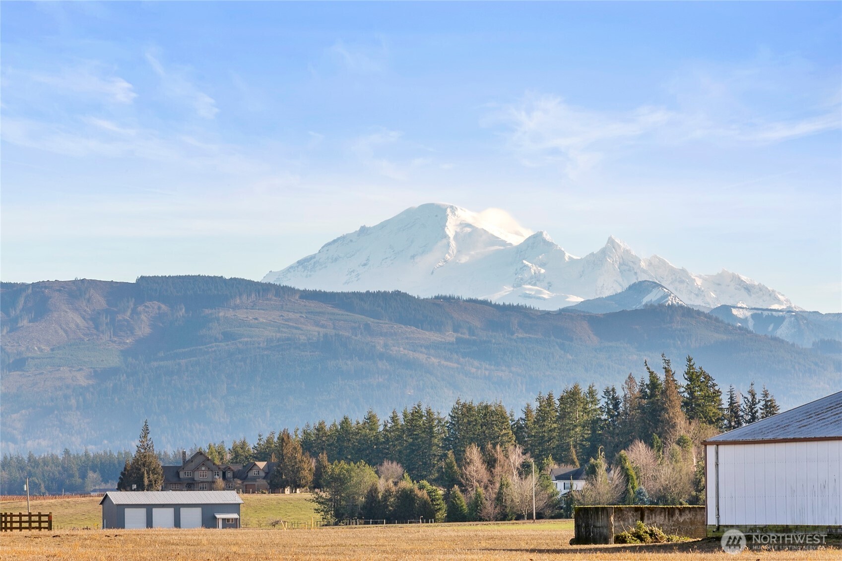 7343 Hannegan Road, Unit 2 Lynden, WA 98264 - Photo 34 of 34 a view of houses with a yard and mountain view