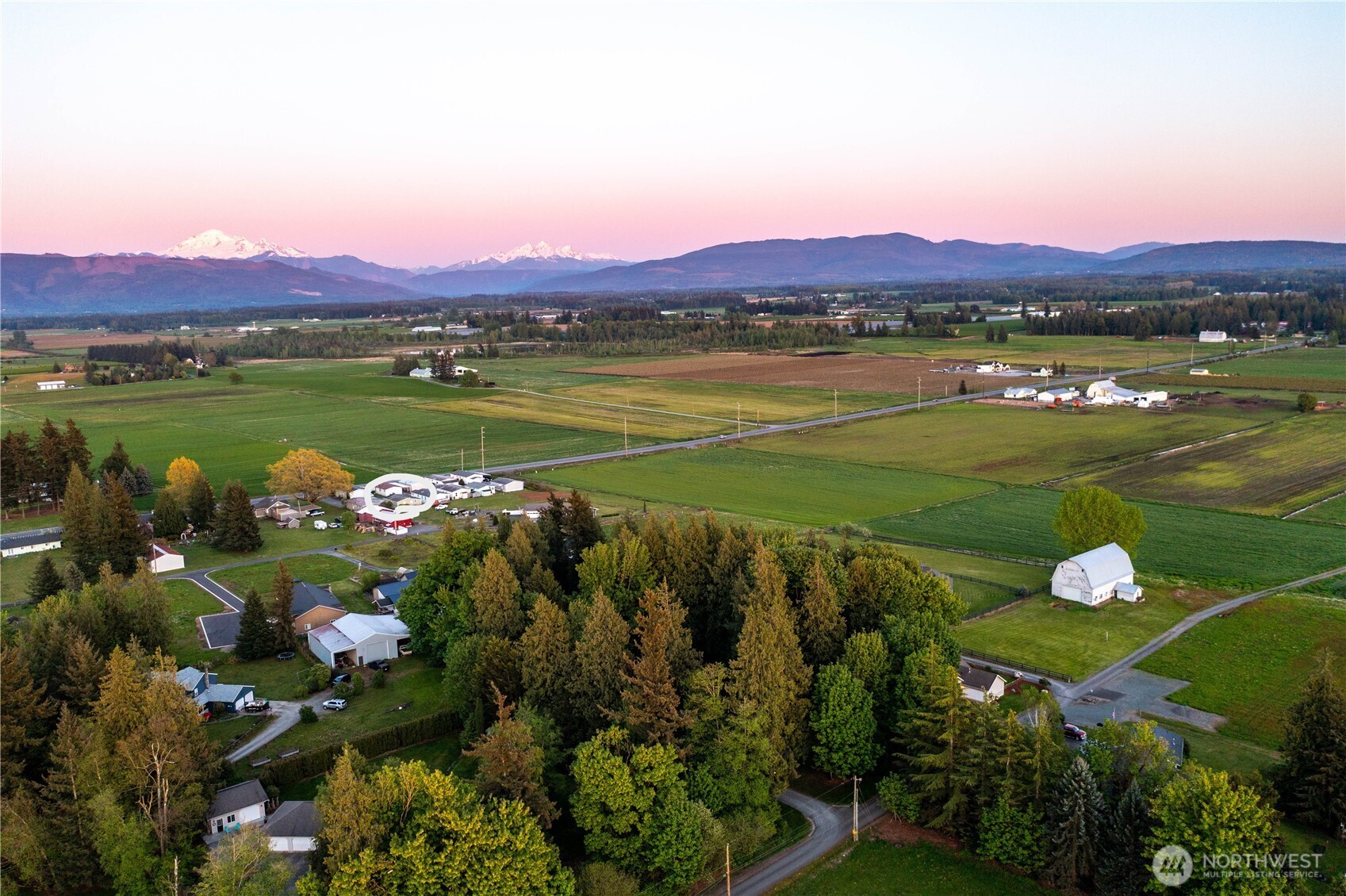 7343 Hannegan Road, Unit 2 Lynden, WA 98264 - Photo 4 of 34 a view of a city with a lake