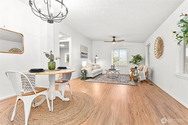 a view of a dining room with furniture window and wooden floor