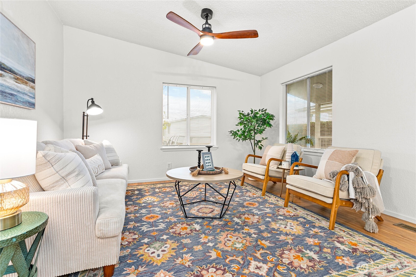 7343 Hannegan Road, Unit 2 Lynden, WA 98264 - Photo 8 of 34 a living room with furniture two window and a table