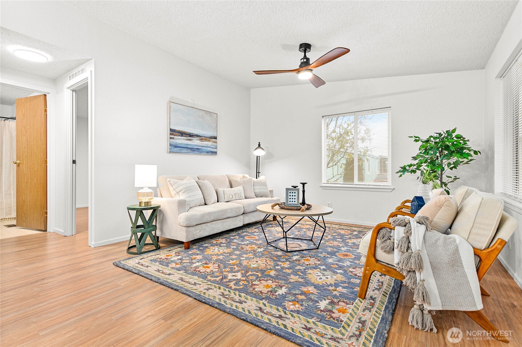 7343 Hannegan Road, Unit 2 Lynden, WA 98264 - Photo 9 of 34 a living room with furniture windows and a wooden floor