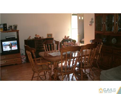 175 Penn Court Old Bridge, NJ 07747 - Photo 3 of 5 a black and white photo of a living room