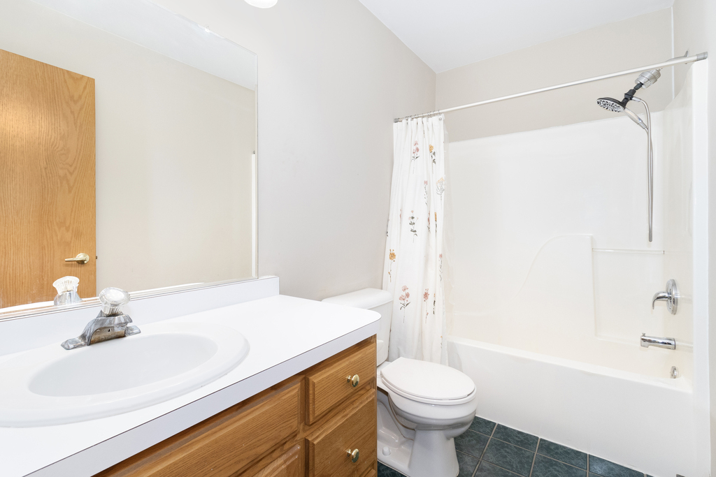126 Twilight Lane New Lenox, IL 60451 - Photo 11 of 15 a bathroom with a sink a toilet and shower