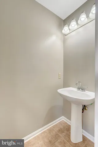 a bathroom with a sink and mirror