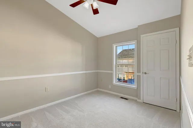 a bathroom with a toilet a sink a mirror and bathtub