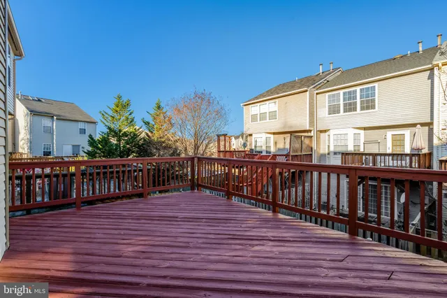 a view of a house with deck and wooden floor