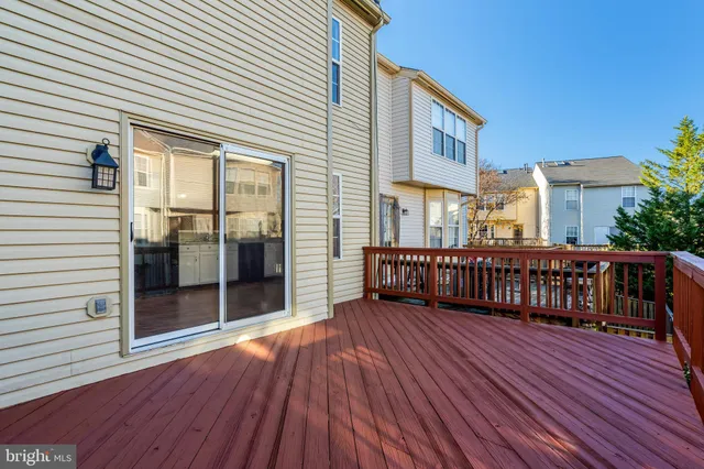 a backyard of a house with wooden fence