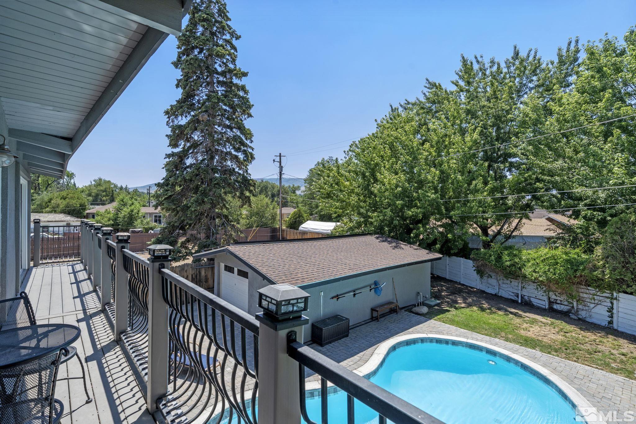 1005 Memory Lane Reno, NV 89509 - Photo 19 of 32 a view of a patio with swimming pool