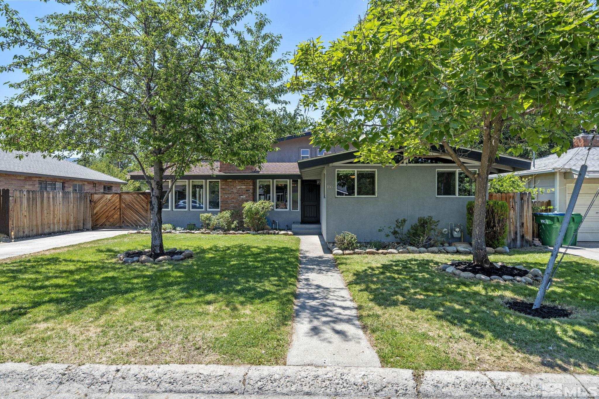 1005 Memory Lane Reno, NV 89509 - Photo 2 of 32 a front view of a house with a yard