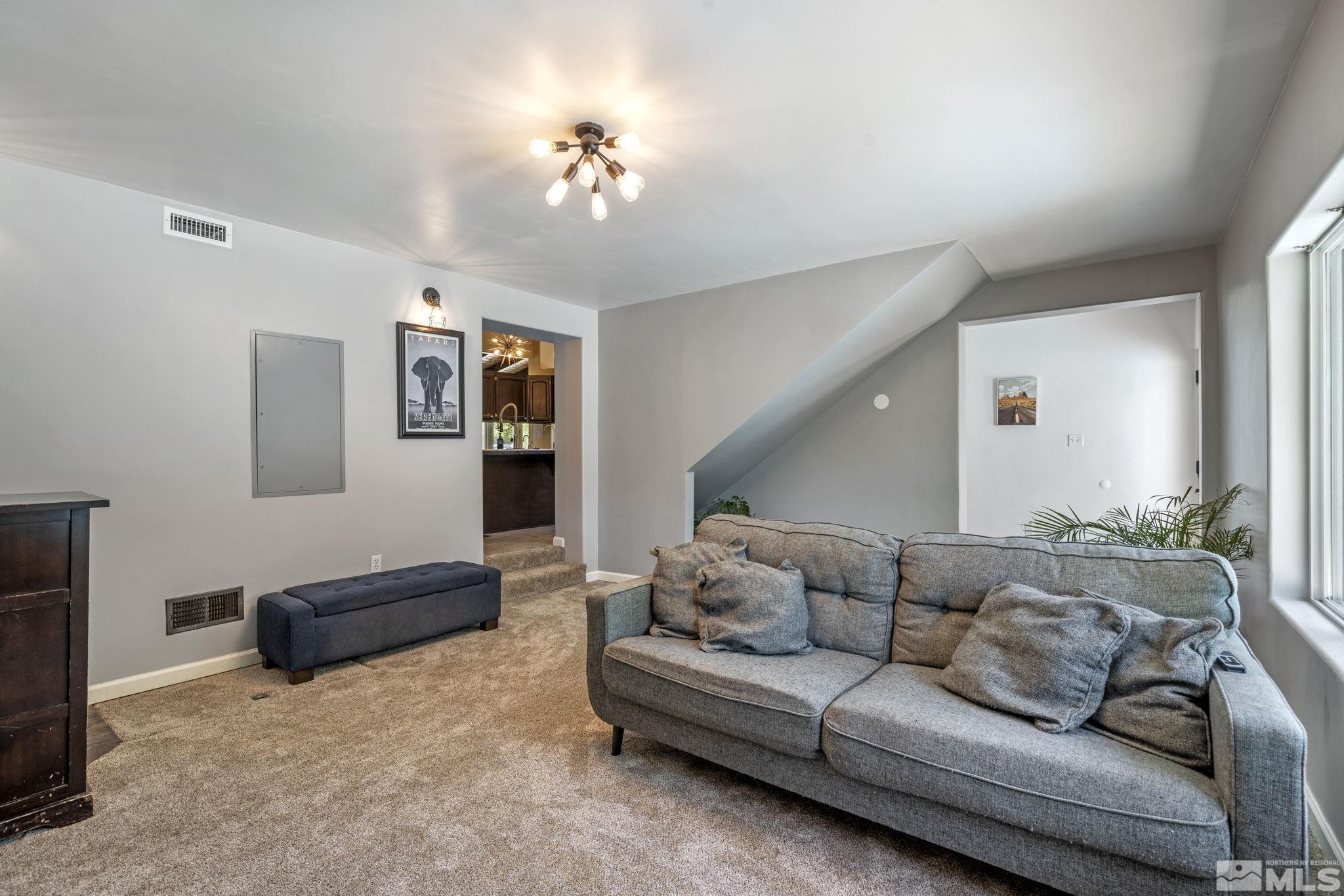 1005 Memory Lane Reno, NV 89509 - Photo 21 of 32 a living room with furniture and a lamp