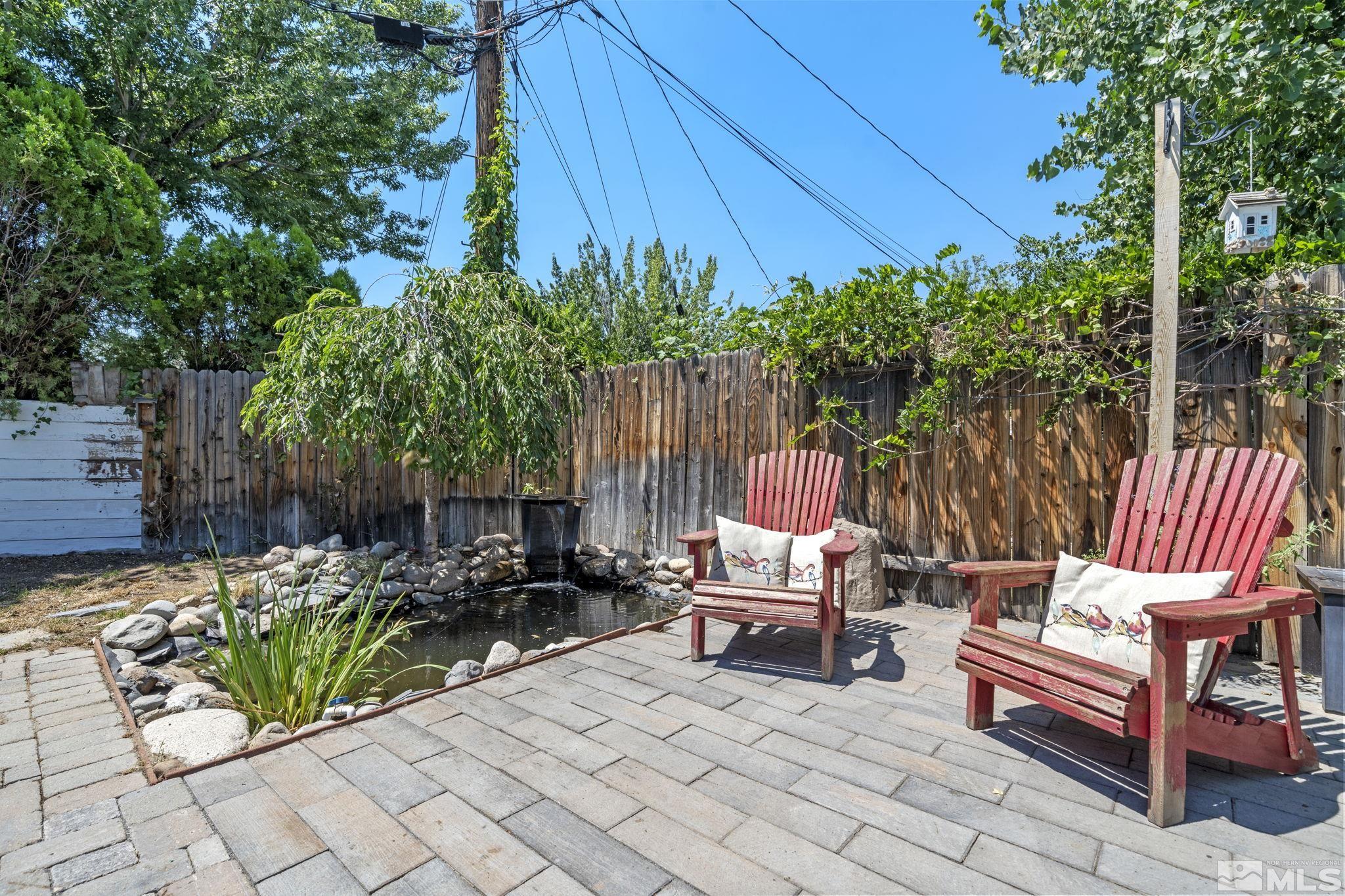 1005 Memory Lane Reno, NV 89509 - Photo 28 of 32 a view of a chairs and table in the back yard of the house