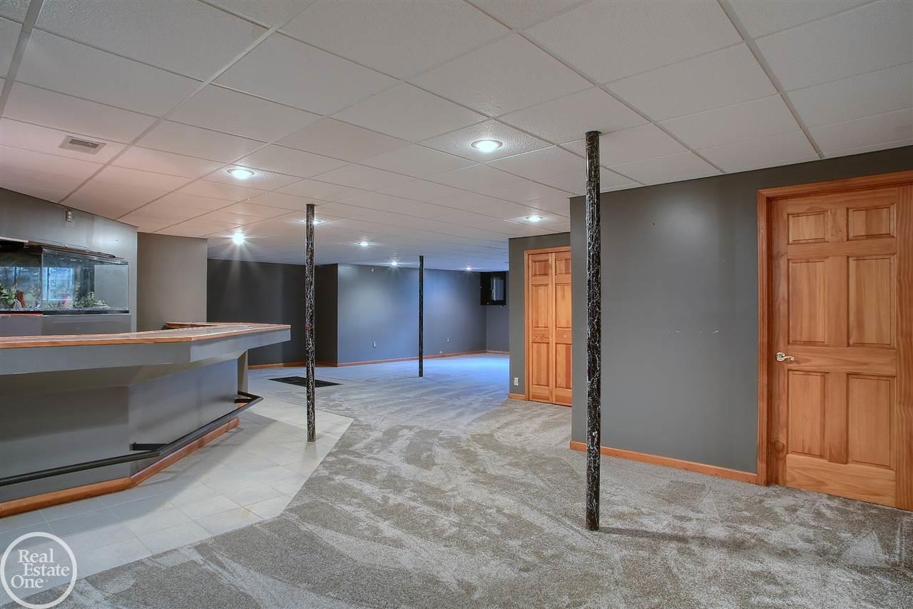 67100 Quail Ridge Washington, MI 48095 - Photo 33 of 52 basement wet bar