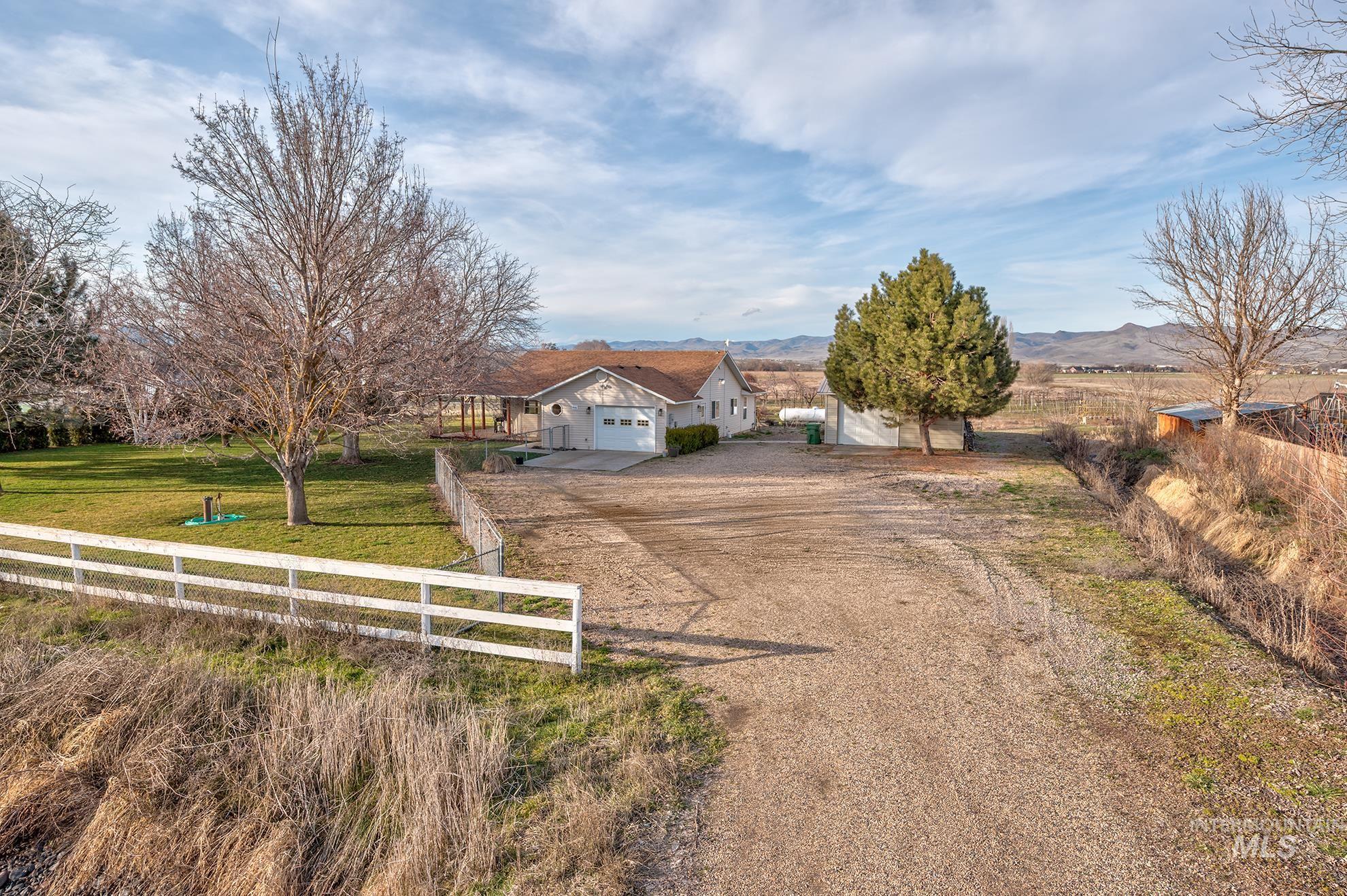 946 Indianhead Road Weiser, ID 83672 - Photo 25 of 36 View of front of house featuring dirt driveway and a mountain view