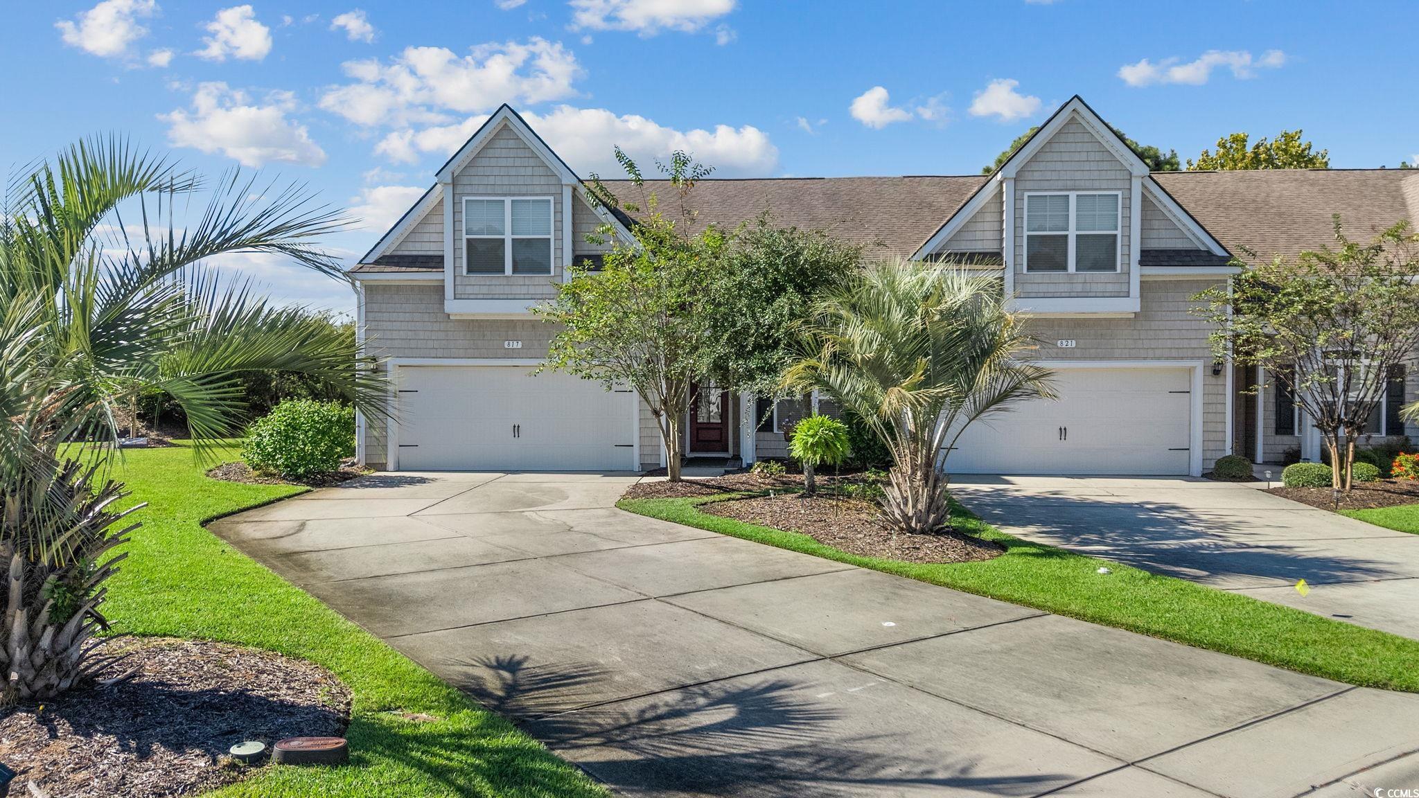 817 Arezzo Way, Unit 1001 Myrtle Beach, SC 29579 - Photo 2 of 40 Shingle-style home featuring driveway, a garage, and a front yard