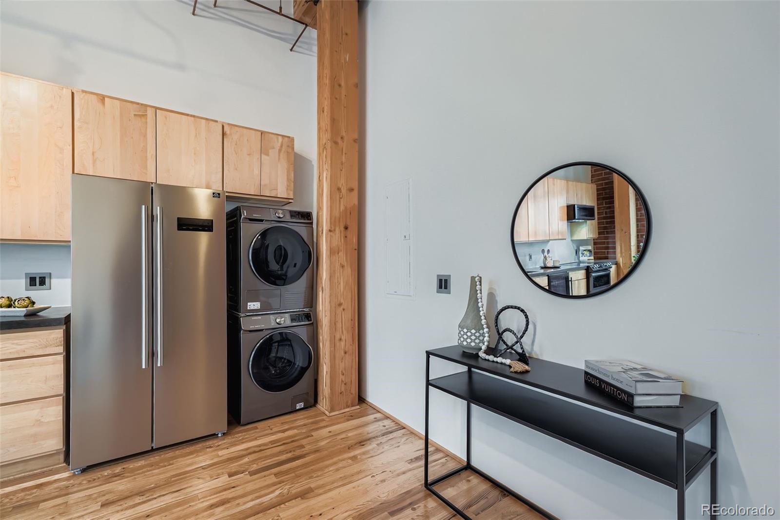 2955 Inca Street, Unit 2H Denver, CO 80202 - Photo 8 of 20 a view of a living room washer and dryer