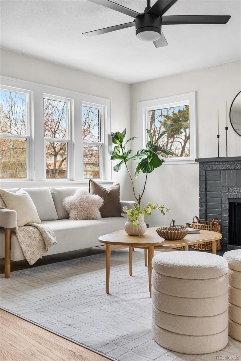1445 Ash Street Denver, CO 80220 - Photo 11 of 45 a living room with furniture and a large window