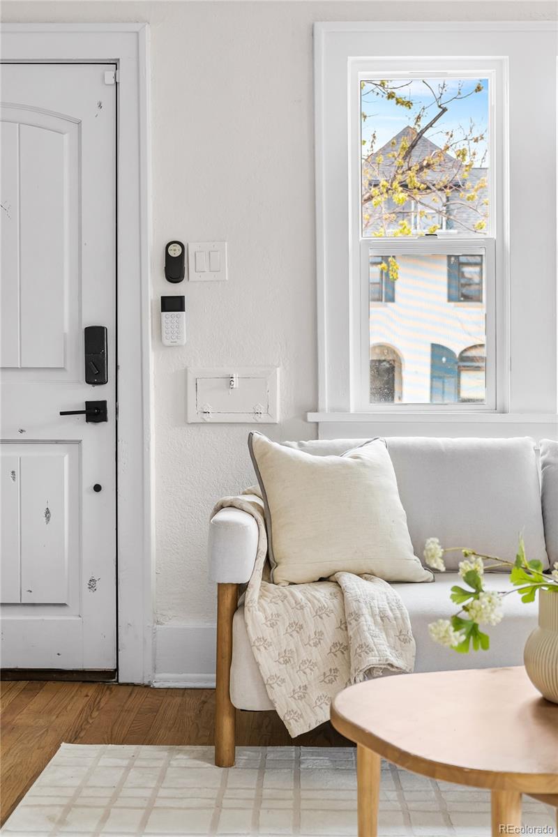 1445 Ash Street Denver, CO 80220 - Photo 12 of 45 a living room with furniture and a window