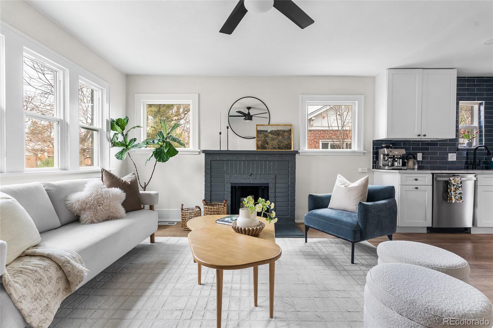 1445 Ash Street Denver, CO 80220 - Photo 20 of 45 a living room with furniture and a fireplace