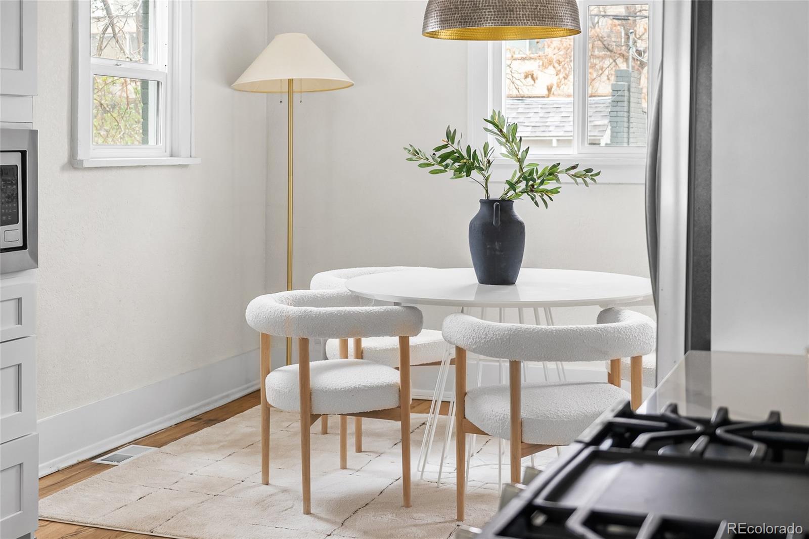 1445 Ash Street Denver, CO 80220 - Photo 22 of 45 a table with a potted plant and a window