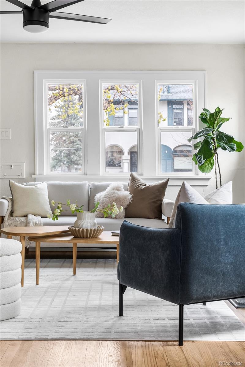1445 Ash Street Denver, CO 80220 - Photo 25 of 45 a living room with furniture and a large window