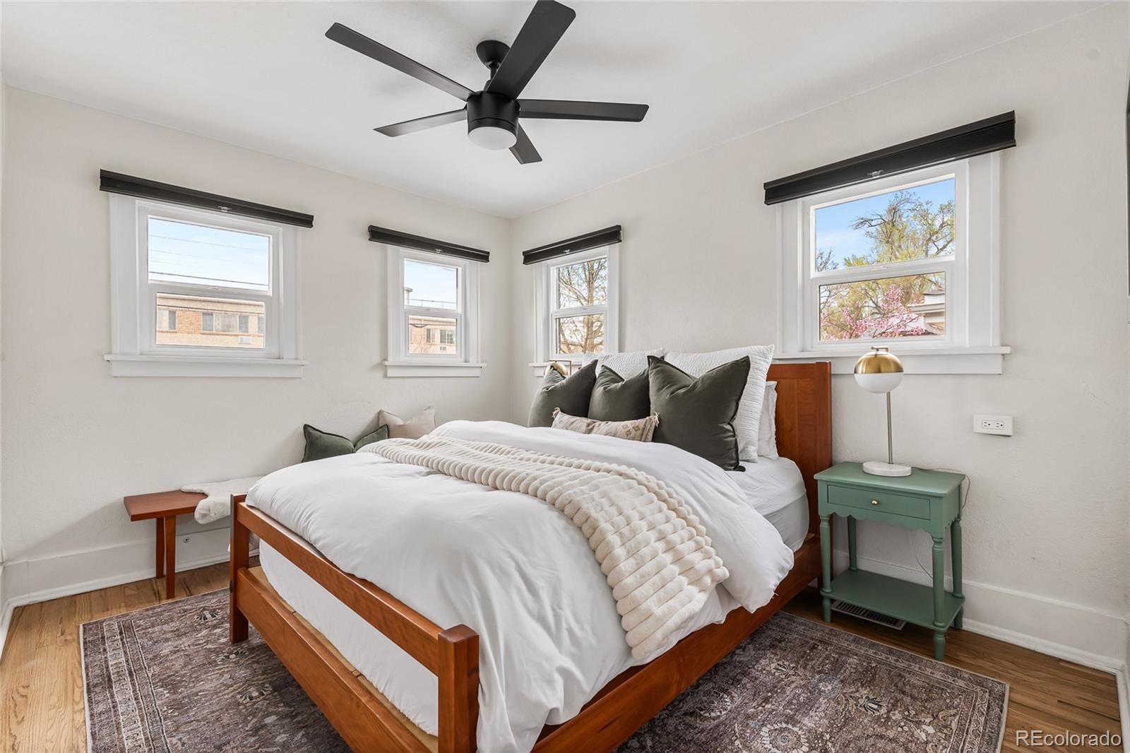 1445 Ash Street Denver, CO 80220 - Photo 27 of 45 a bed room with a bed and a tv