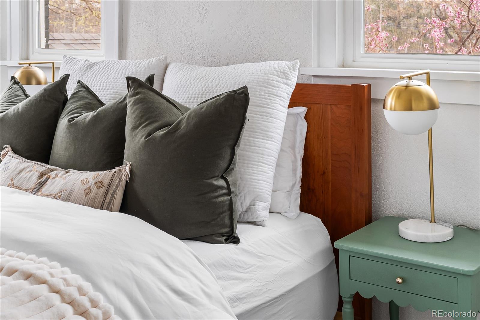 1445 Ash Street Denver, CO 80220 - Photo 29 of 45 a bedroom with a bed and dresser