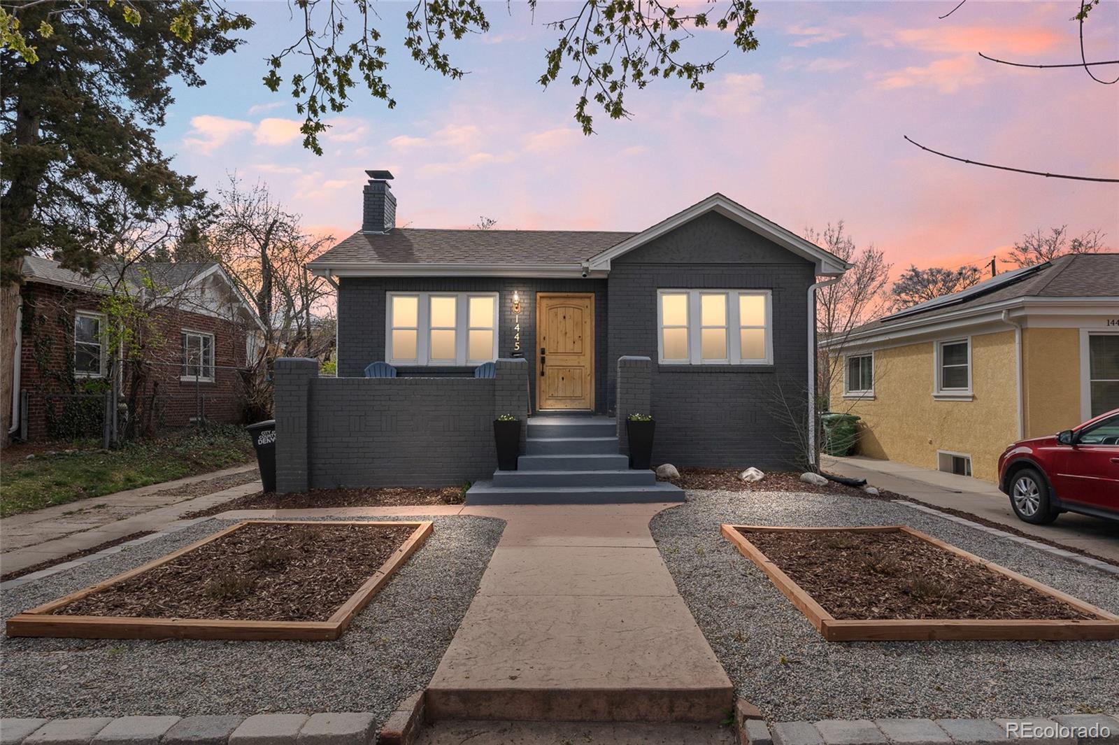 1445 Ash Street Denver, CO 80220 - Photo 3 of 45 a front view of a house