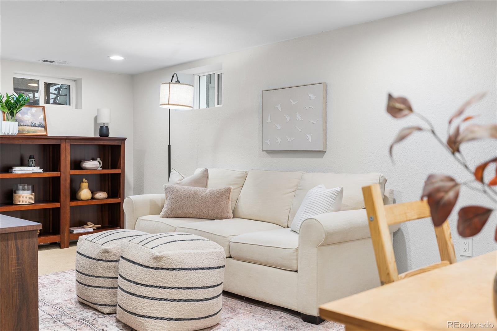 1445 Ash Street Denver, CO 80220 - Photo 38 of 45 a living room with hard wood floor and a couch