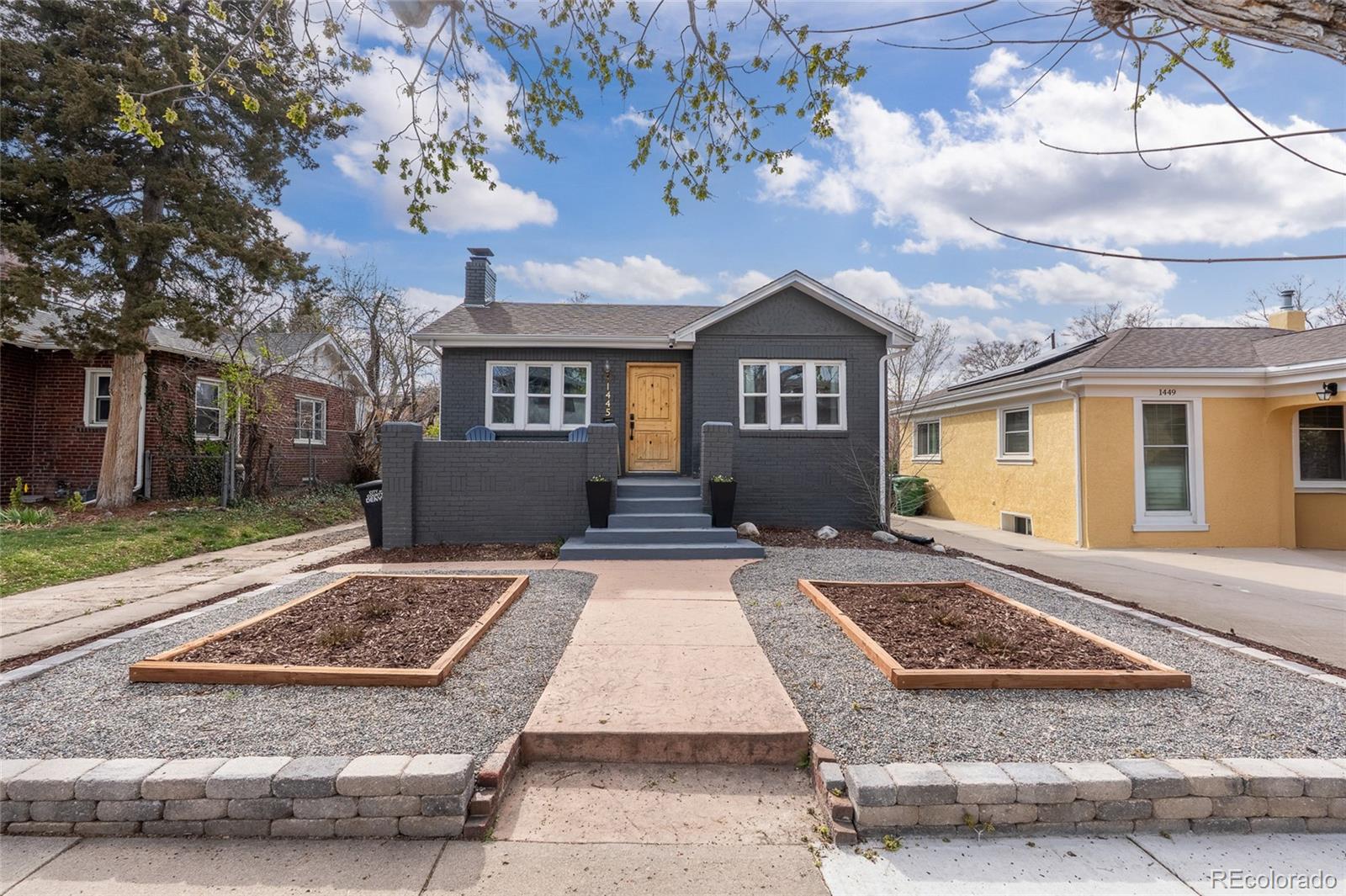 1445 Ash Street Denver, CO 80220 - Photo 40 of 45 front view of house with a yard